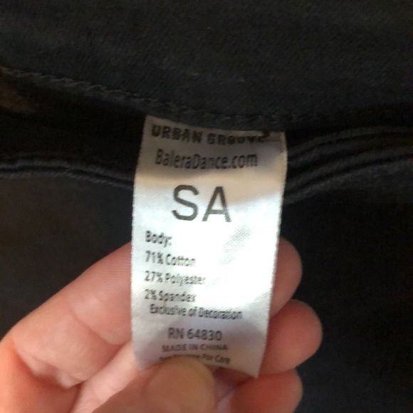 Size 4 Black stretchy jeans with holes in each leg. - Picture 3 of 5